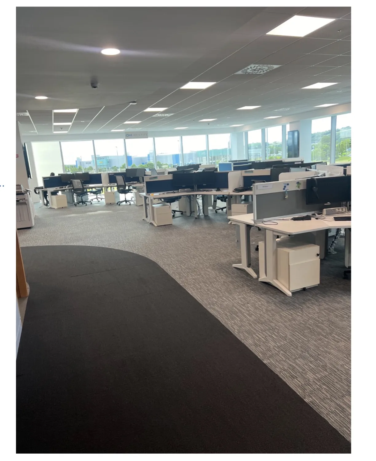 Large open-plan office with desks and chairs